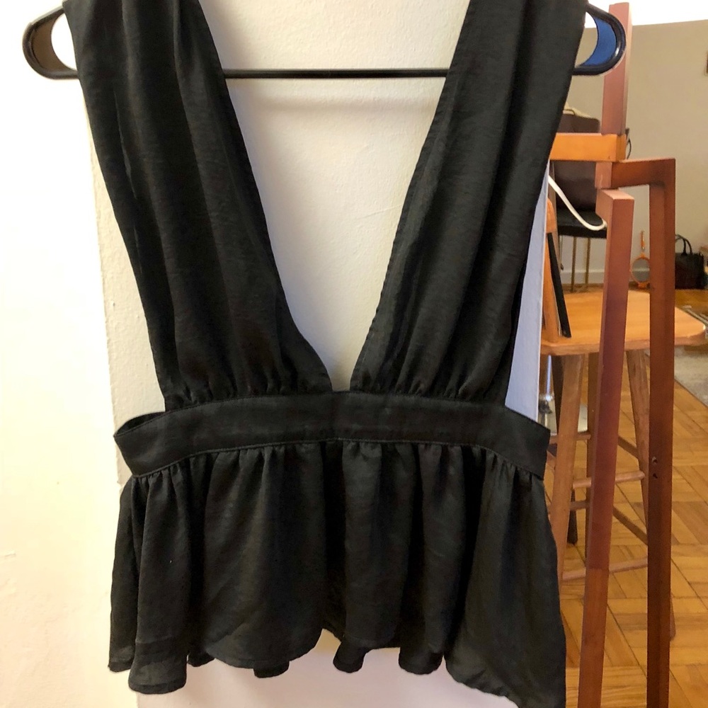 NWT Urban Outfitters slinky peplum black top